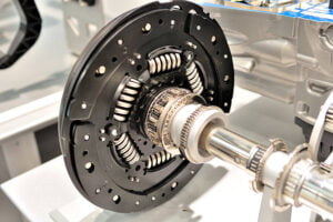 Clutch plate on an axle with bearing.
